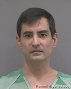 Mugshot of Christopher Jun Otton booked in Alachua County, Florida on October 15, 2026