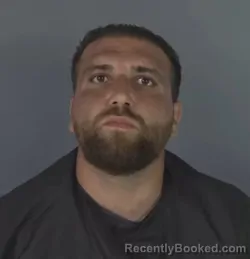 Mugshot of MUSTAFA AL MUKHTAR