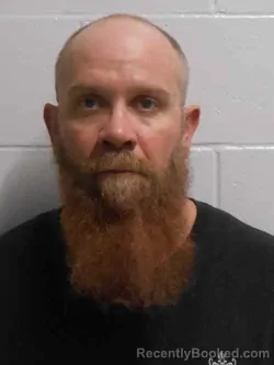 Mugshot of JOSHUA LEE HOLMES booked in Henry County, Iowa on April 2, 2026