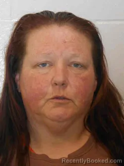 Mugshot of MONICA MAE WOODSMALL booked in Henry County, Iowa on March 22, 2026