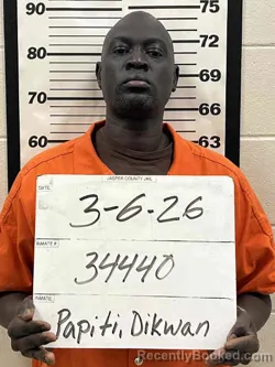 Mugshot of DIKWAN OYAY PAPITI booked in Jasper County, Iowa on March 6, 2026