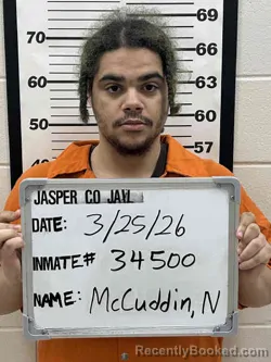 Mugshot of NIGEL THOMAS JAMES MCCUDDIN booked in Jasper County, Iowa on March 25, 2026