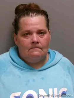 Mugshot of CARRIE LOU CARSON booked in Lee County, Iowa on July 10, 2026