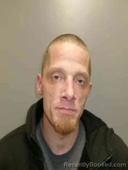 Mugshot of CHRISTOPHER ALLEN JR VRADENBURG booked in Lee County, Iowa on March 27, 2026