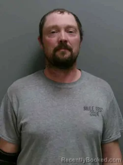 Mugshot of JUSTIN REED MILLER booked in Lee County, Iowa on March 26, 2026