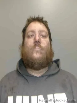 Mugshot of JON LAWRENCE ROONEY booked in Lee County, Iowa on March 26, 2026