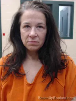 Mugshot of CATHERINE DENISE HAMPTON booked in Louisa County, Iowa on April 9, 2026