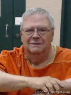 Mugshot of ROGER DALE GRABER booked in Louisa County, Iowa on April 15, 2026