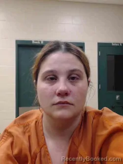 Mugshot of FAITH ISABELLA COLE booked in Louisa County, Iowa on April 14, 2026