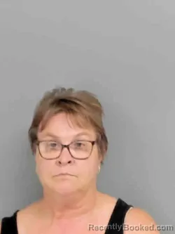 Mugshot of CORRIE JO SIMMONS booked in Marion County, Iowa on August 3, 2026