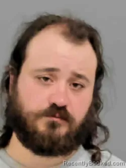 Mugshot of DANIEL KUEFFER ROSS REGNA booked in Marion County, Iowa on April 23, 2026