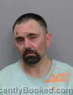 Mugshot of JOSHUA THOMAS WARNELL booked in Marshall County, Iowa on July 15, 2026