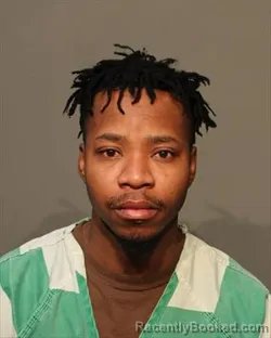 Mugshot of MZALIWA MKANGYA booked in Polk County, Iowa on March 13, 2026