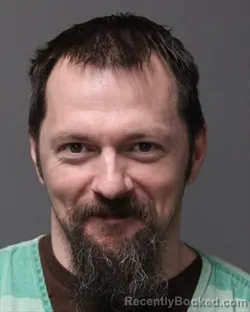 Mugshot of JUSTIN LEE DAHM booked in Polk County, Iowa on March 13, 2026