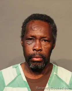 Mugshot of LINO ARINO OJUT booked in Polk County, Iowa on March 14, 2026