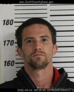 Mugshot of Austin Michael Bennett booked in Scott County, Iowa on September 1, 2026