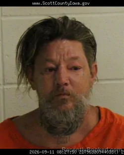 Mugshot of Delmar Eugene Micha Baughman booked in Scott County, Iowa on September 10, 2026