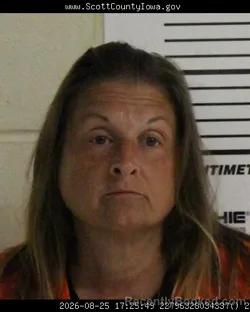 Mugshot of Karen Ann Kusch booked in Scott County, Iowa on August 25, 2026