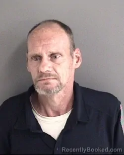 Mugshot of Christopher Robert Mort booked in Story County, Iowa on August 24, 2026