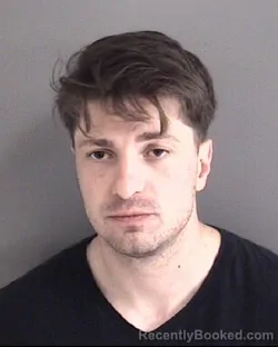 Mugshot of GARRETT BRYCE COOK booked in Story County, Iowa on April 25, 2026