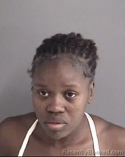 Mugshot of Laeticia Suzann Guedeyi  Zodobi booked in Story County, Iowa on September 7, 2026