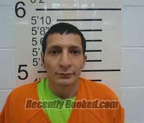 Booking photo from Warren County, Iowa