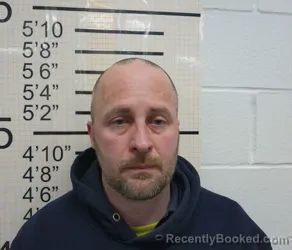 Mugshot of JOHN HOSEA HEWS booked in Warren County, Iowa on March 27, 2026