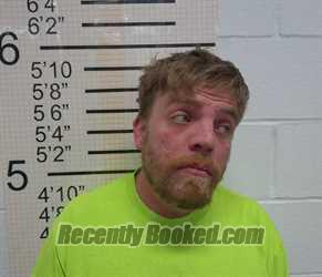 Booking photo from Warren County, Iowa