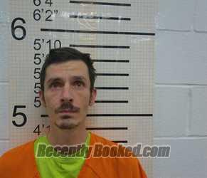 Booking photo from Warren County, Iowa