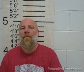 Booking photo from Warren County, Iowa