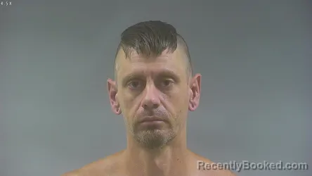 Mugshot of Aaron Wayne Neuzil booked in Washington County, Iowa on August 8, 2026