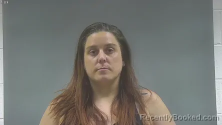 Mugshot of KRYSTAL LYNN STUTZMAN booked in Washington County, Iowa on May 14, 2026