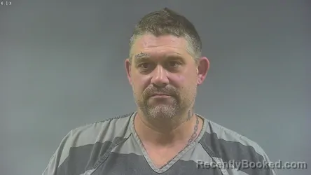 Mugshot of Ehren David Schneider booked in Washington County, Iowa on August 31, 2026