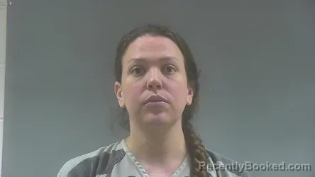 Mugshot of TIANA ISABELLA SCHLATTER booked in Washington County, Iowa on April 30, 2026