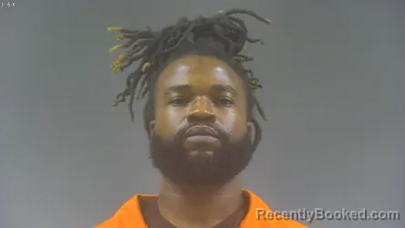 Mugshot of ROLAND KPAEYEH booked in Washington County, Iowa on March 23, 2026