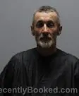 Mugshot of Charlie Mcguinn Holcombe booked in Pickens County, South Carolina on October 13, 2026