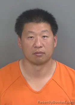 Mugshot of DEXING ZHANG booked in Collier County, Florida on March 12, 2026