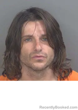 Mugshot of RUSSELL THOMAS SUTTON booked in Collier County, Florida on May 10, 2026