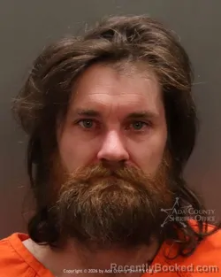 Mugshot of Travis Michael Saine booked in Ada County, Idaho on March 24, 2026