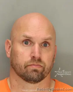 Mugshot of Dustin Michael Olson booked in Ada County, Idaho on May 18, 2026