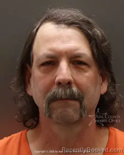 Mugshot of Christian Robin Houde booked in Ada County, Idaho on March 27, 2026