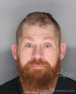 Mugshot of Jonathon Wilferd Drennon booked in Ada County, Idaho on July 6, 2026