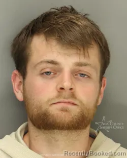 Mugshot of Nicolas Stokes Holden booked in Ada County, Idaho on August 14, 2026