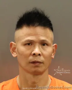Mugshot of Wenguang Hu booked in Ada County, Idaho on September 28, 2026
