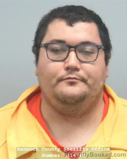Mugshot of Roman Michael Adams booked in Bannock County, Idaho on August 19, 2026