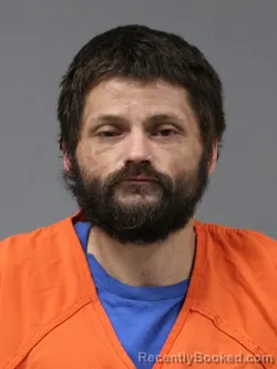 Mugshot of Travis Lee Muetze