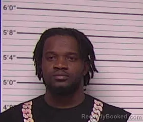 Mugshot of MILOT DENIE booked in Bladen County, North Carolina on March 29, 2026