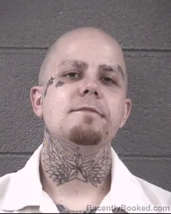 Mugshot of AUSTIN TYLER STINNETTE booked in Buncombe County, North Carolina on March 12, 2026