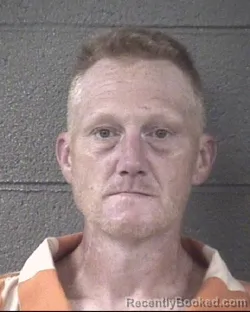 Mugshot of CHRISTOPHER ADAM TRAVIS booked in Buncombe County, North Carolina on July 12, 2026