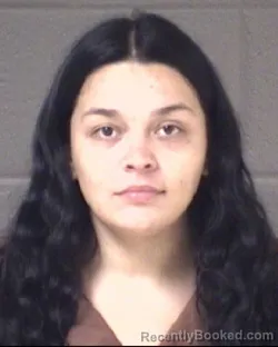 Mugshot of Justina Esperanza Beltran booked in Buncombe County, North Carolina on August 24, 2026